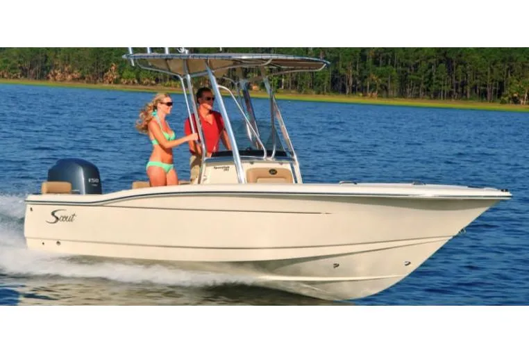 Slide: The Image of Manufacturer Provided Image: 2020 Scout 195 Sportfish boat cruising on a lake with two passengers. - 2