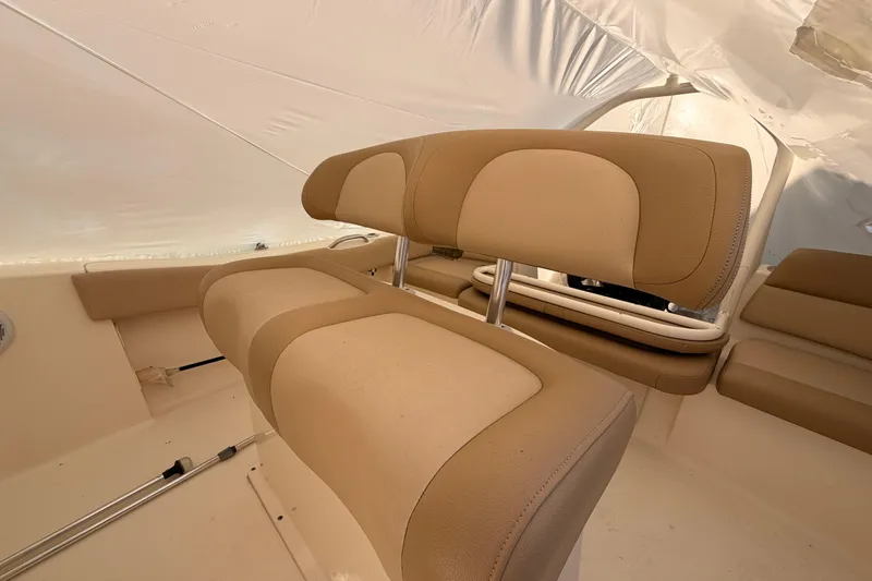 Slide: The Image of 2020 Scout 195 Sportfish boat interior with beige seating and sleek design. - 6