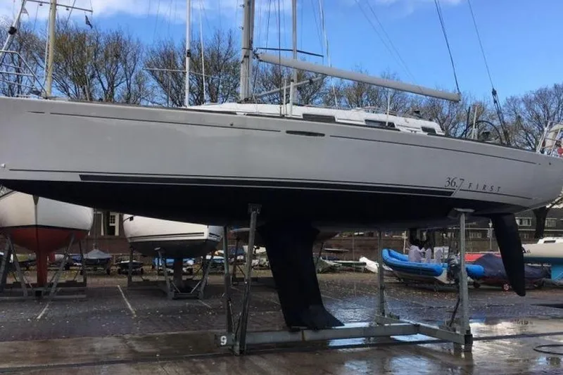 Slide: The Image of 2002 Beneteau First 36.7 sailboat on dry dock, ready for maintenance. - 9