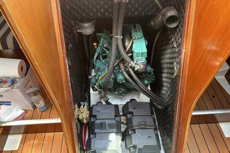 Slide: The Image of Engine compartment of a 2002 Beneteau First 36.7 sailboat, featuring a well-maintained motor. - 11