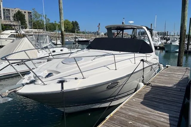 The Image of 2014 Monterey 280 Sport Yacht docked at marina under clear blue sky. - 0