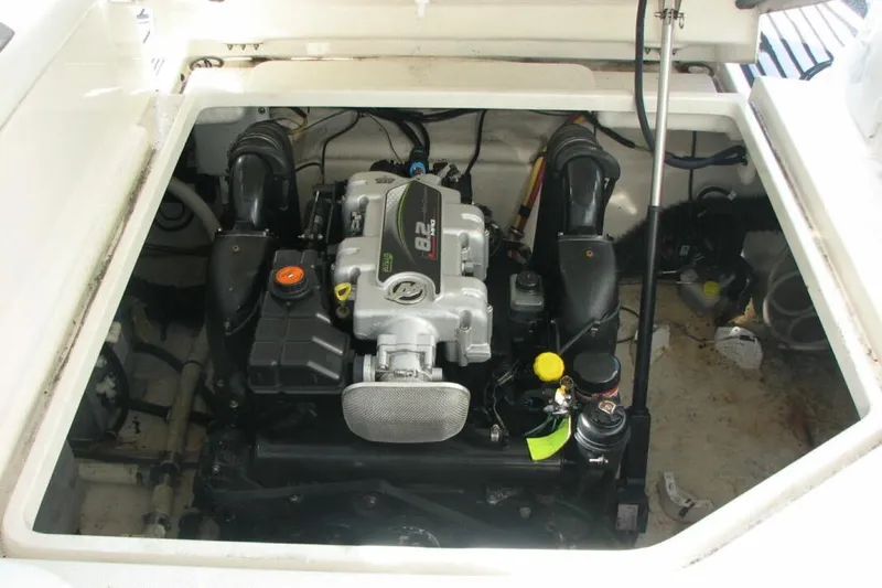 Slide: The Image of Engine compartment of a 2014 Monterey 280 Sport Yacht, showcasing the powerful engine setup. - 11