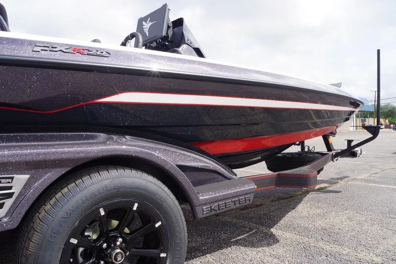Slide: The Image of 2026 Skeeter FXR20 PRO boat on trailer, showcasing sleek design and vibrant colors. - 12
