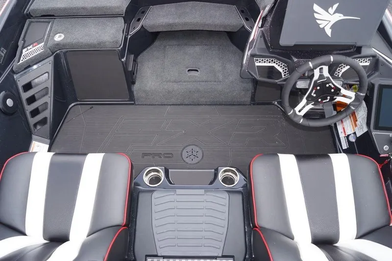 Slide: The Image of 2026 Skeeter FXR20 PRO boat interior with steering wheel and seating. - 13