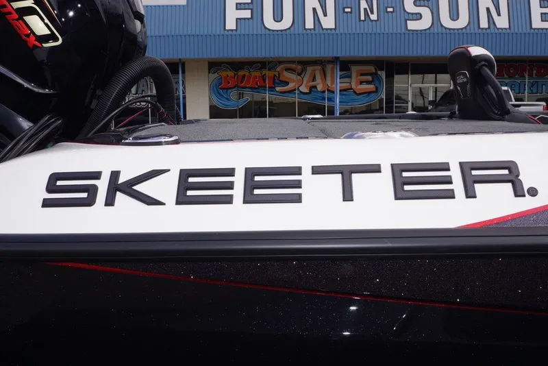 Slide: The Image of 2026 Skeeter FXR20 PRO boat at dealership with "Fun-N-Sun" sign in background. - 15