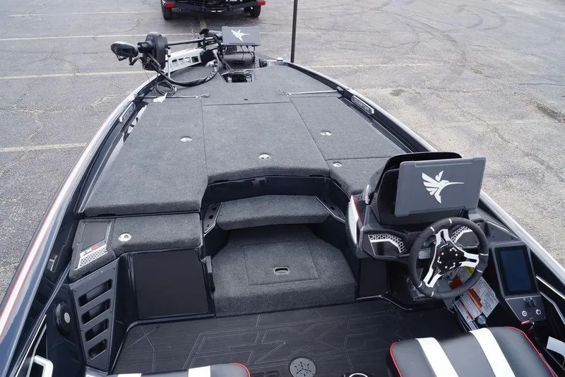 Slide: The Image of 2026 Skeeter FXR20 PRO boat interior with advanced dashboard and steering wheel design. - 16