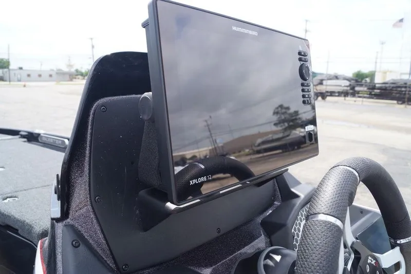 Slide: The Image of 2026 Skeeter FXR20 PRO boat dashboard with Humminbird fishfinder display. - 17