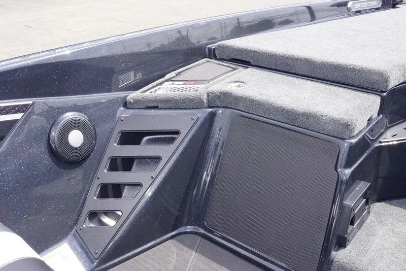 Slide: The Image of 2026 Skeeter FXR20 PRO boat interior with speaker and carpeted deck. - 24