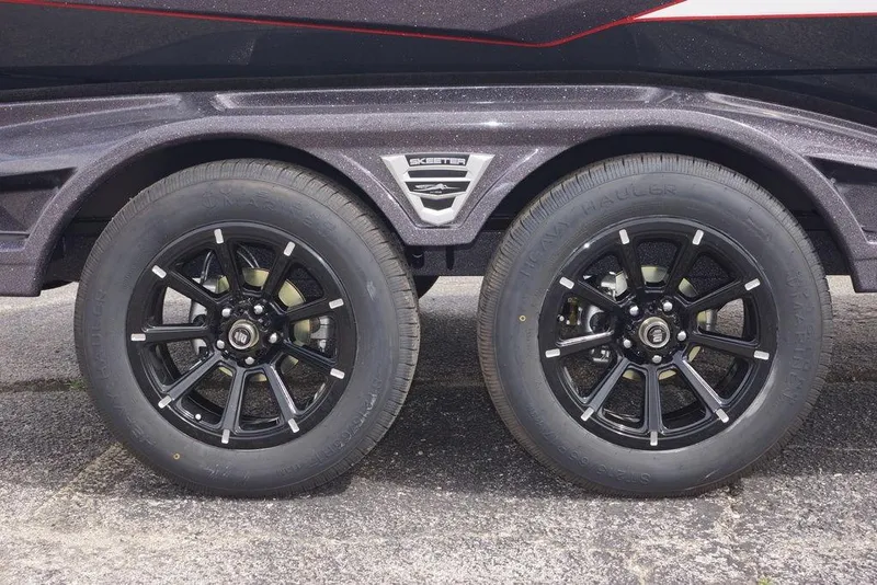 Slide: The Image of 2026 Skeeter FXR20 PRO trailer with black alloy wheels and tires. - 3