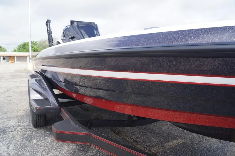 Slide: The Image of 2026 Skeeter FXR20 PRO boat on trailer, showcasing sleek design and vibrant colors. - 6