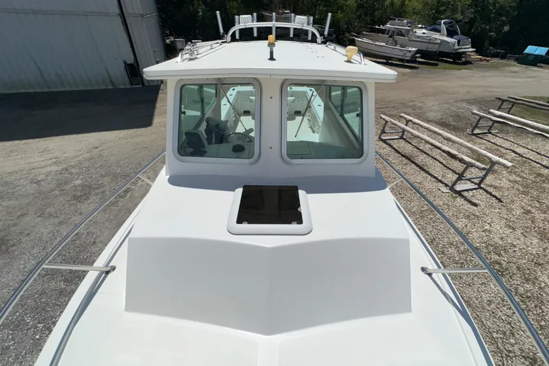 Slide: The Image of 2009 Steiger Craft 255 Miami boat on dry dock, front view. - 10