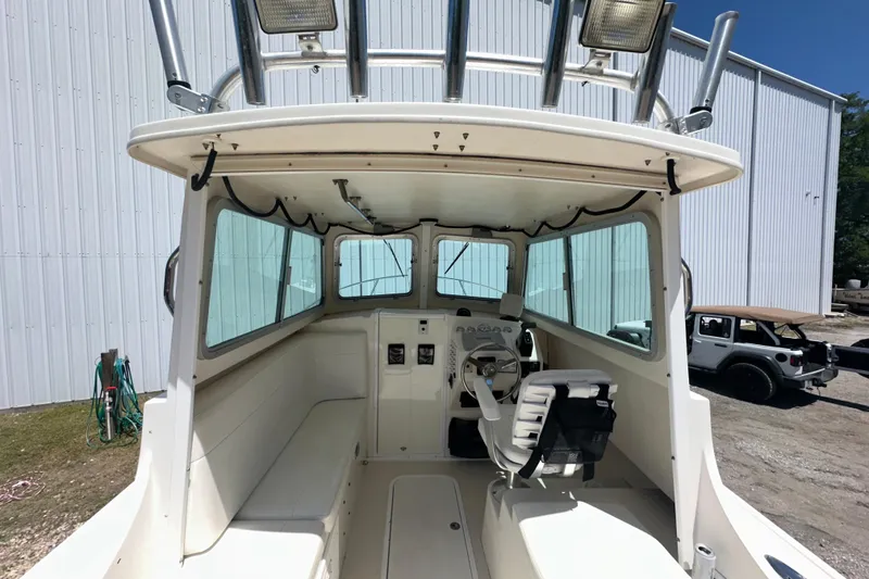 Slide: The Image of 2009 Steiger Craft 255 Miami boat interior with helm and seating area. - 21