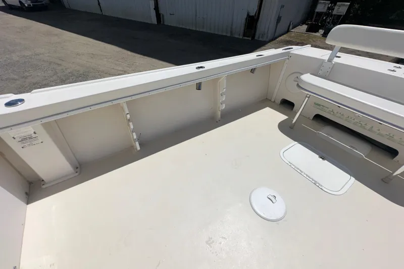 Slide: The Image of 2009 Steiger Craft 255 Miami boat deck with seating and storage compartments. - 22