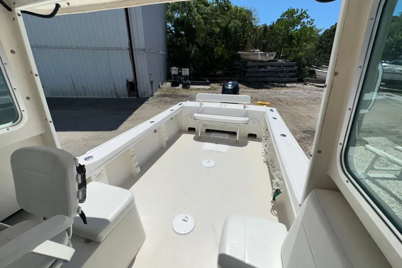 Slide: The Image of 2009 Steiger Craft 255 Miami boat interior with seating and open deck space. - 26