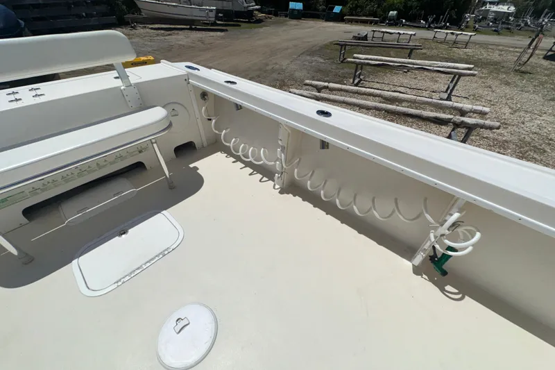 Slide: The Image of 2009 Steiger Craft 255 Miami boat deck with seating and storage compartments. - 28