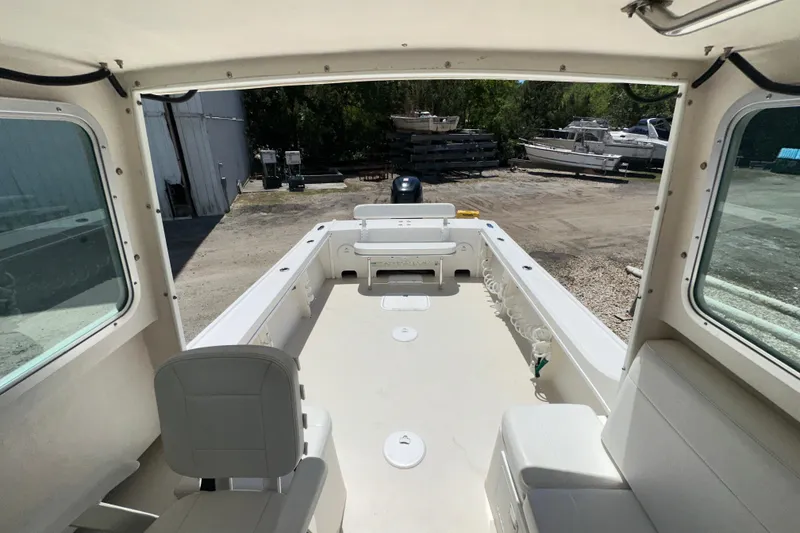 Slide: The Image of 2009 Steiger Craft 255 Miami boat interior with seating and open deck. - 29