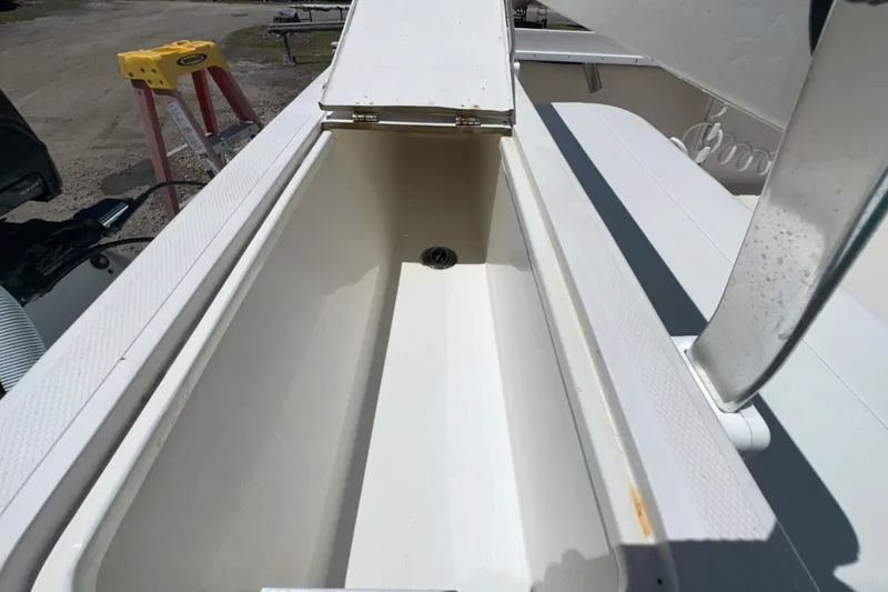 Slide: The Image of Open storage compartment on a 2009 Steiger Craft 255 Miami boat. - 33