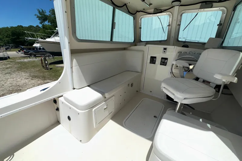 Slide: The Image of Interior of 2009 Steiger Craft 255 Miami boat with seating and helm station. - 35