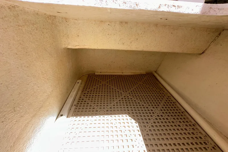 Slide: The Image of Interior view of a 2009 Steiger Craft 255 Miami boat compartment with textured flooring. - 44