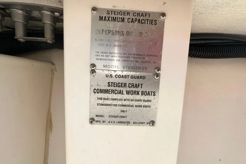 Slide: The Image of 2009 Steiger Craft 255 Miami capacity plate, detailing maximum load and compliance standards. - 47