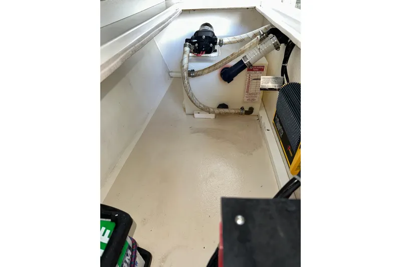 Slide: The Image of 2009 Steiger Craft 255 Miami boat interior showing storage compartment and equipment. - 49