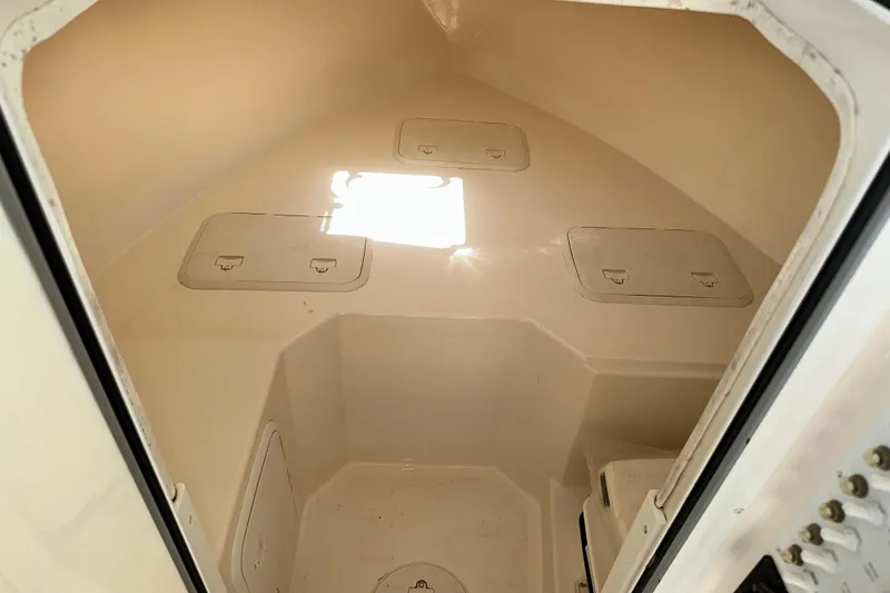 Slide: The Image of Interior cabin of 2009 Steiger Craft 255 Miami boat, featuring storage compartments. - 51