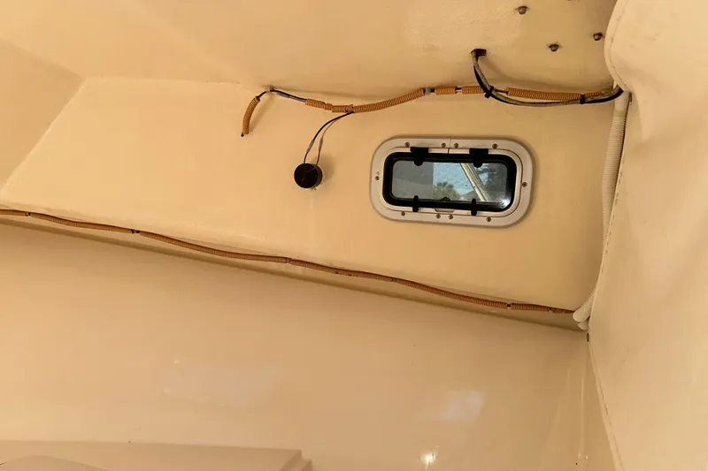 Slide: The Image of Interior view of 2009 Steiger Craft 255 Miami boat cabin with window and wiring. - 55