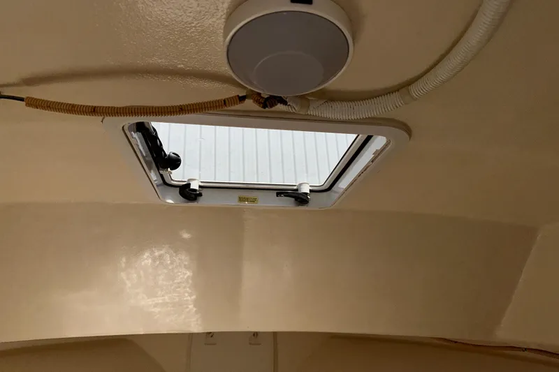 Slide: The Image of Interior view of a 2009 Steiger Craft 255 Miami boat hatch and ceiling. - 56