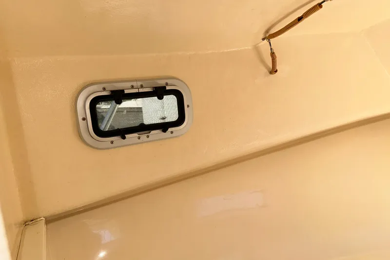 Slide: The Image of Interior view of a 2009 Steiger Craft 255 Miami boat cabin window. - 57