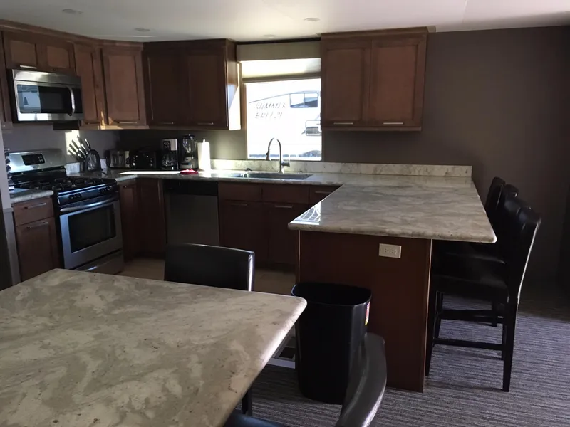 Slide: The Image of Modern kitchen with granite countertops and wooden cabinets, Bravada Discovery 2015. - 3