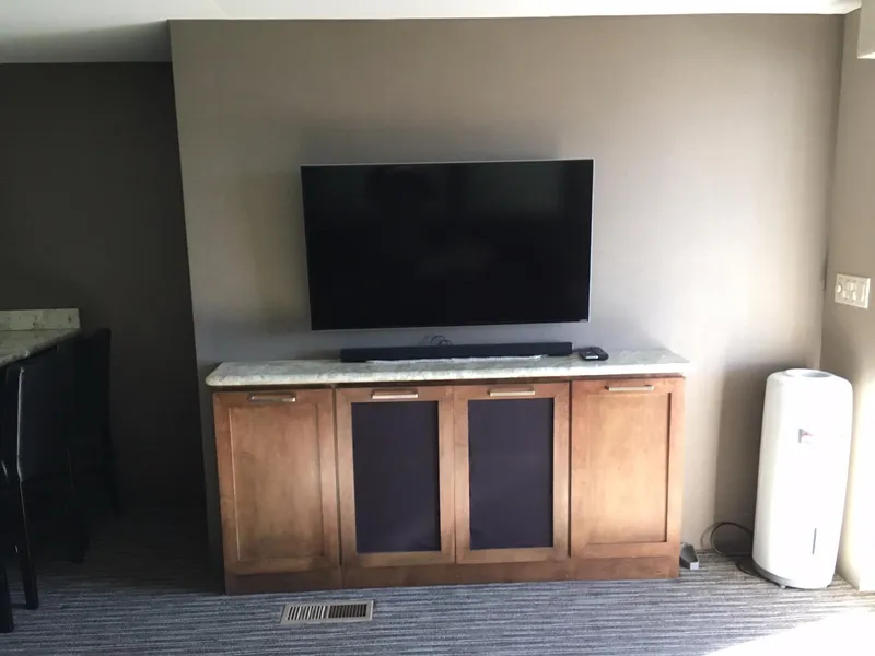 Slide: The Image of Flat-screen TV on wooden cabinet in modern living room. - 4