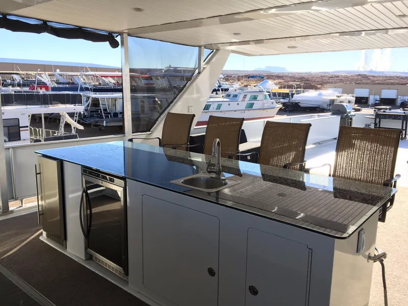 Slide: The Image of Luxurious Bravada yacht with modern outdoor kitchen in harbor. - 9
