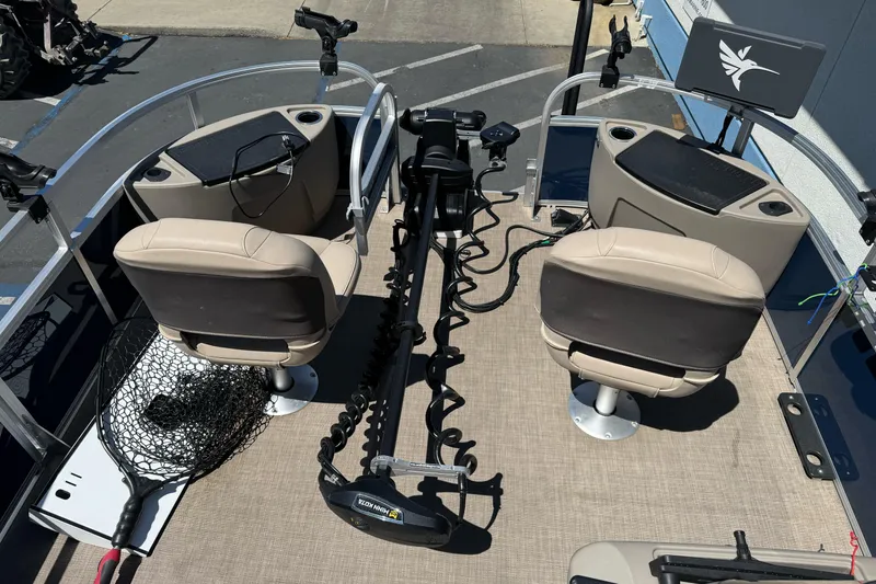 Slide: The Image of 2025 Sun Tracker Bass Buggy 18 DLX interior with fishing seats and equipment. - 11