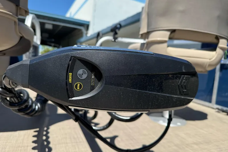 Slide: The Image of Close-up of a 2025 Sun Tracker Bass Buggy 18 DLX boat control panel. - 12