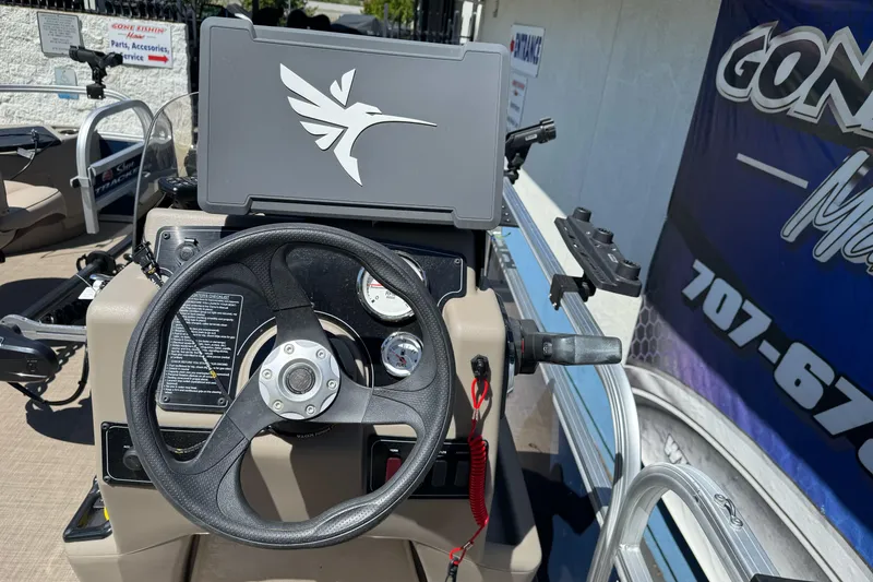 Slide: The Image of Steering console of 2025 Sun Tracker Bass Buggy 18 DLX pontoon boat. - 18