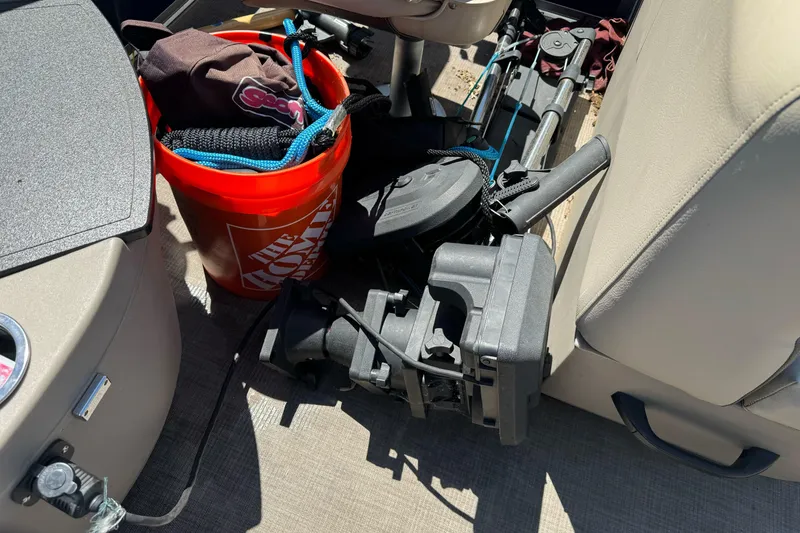 Slide: The Image of Interior of 2025 Sun Tracker Bass Buggy 18 DLX with fishing gear and bucket. - 25