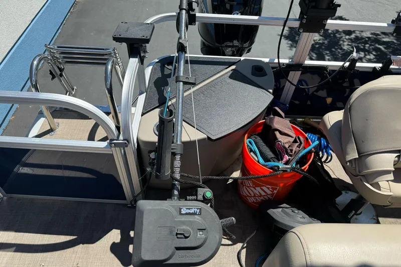 Slide: The Image of Interior of 2025 Sun Tracker Bass Buggy 18 DLX with fishing gear and equipment. - 26