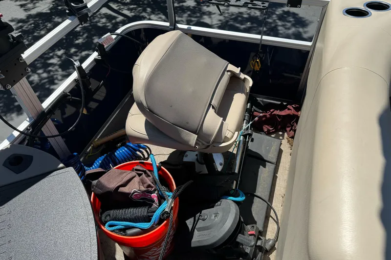 Slide: The Image of Interior of 2025 Sun Tracker Bass Buggy 18 DLX with fishing gear and seating. - 29