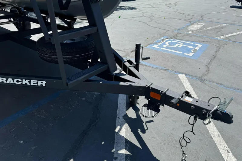 Slide: The Image of Trailer hitch of 2025 Sun Tracker Bass Buggy 18 DLX in parking lot. - 4