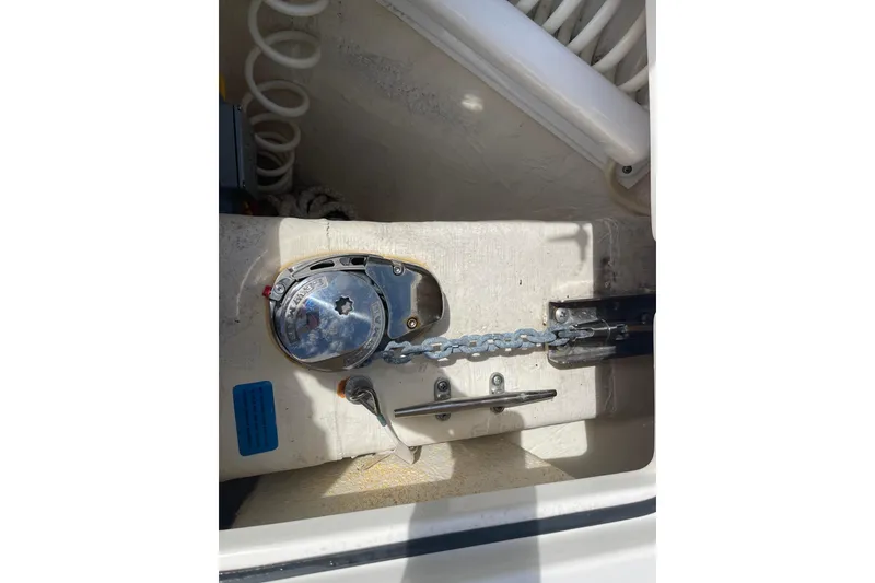 Slide: The Image of Anchor chain mechanism on 2023 Cobia 280 Dual Console boat. - 19