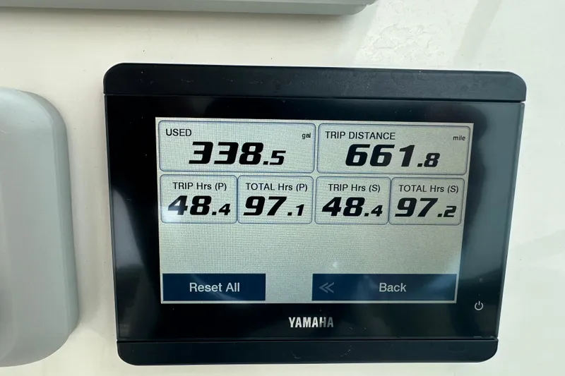 Slide: The Image of Yamaha display showing fuel usage and trip data for 2023 Cobia 280 Dual Console. - 36