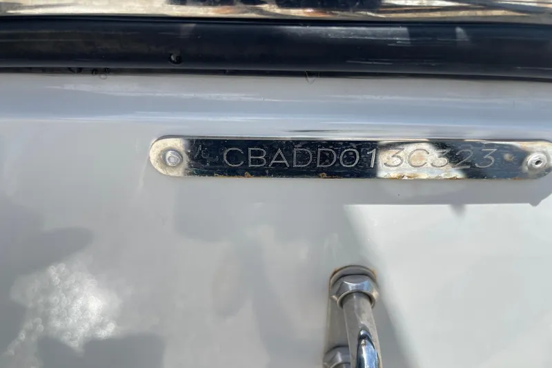 Slide: The Image of 2023 Cobia 280 Dual Console boat identification plate with serial number. - 47