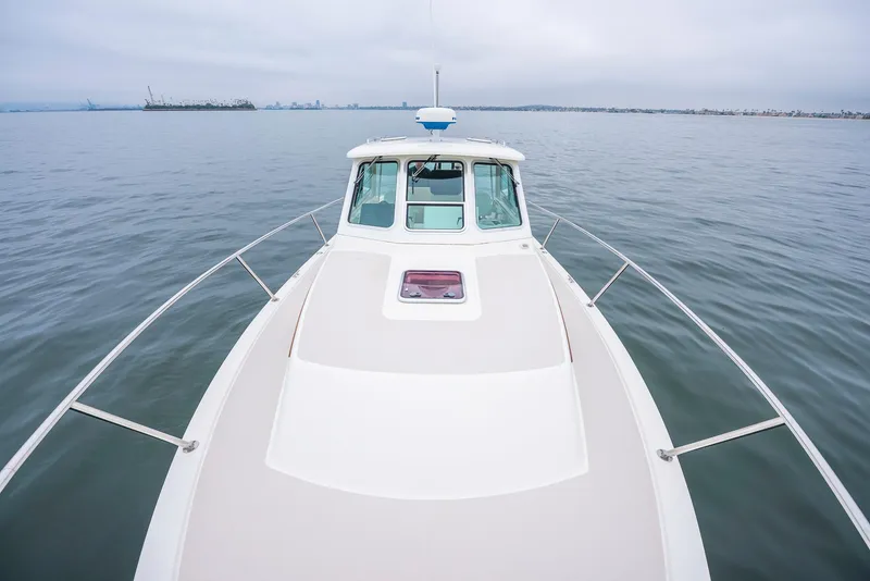 Slide: The Image of 2005 Back Cove Downeast Hardtop boat on calm water, viewed from the bow. - 29