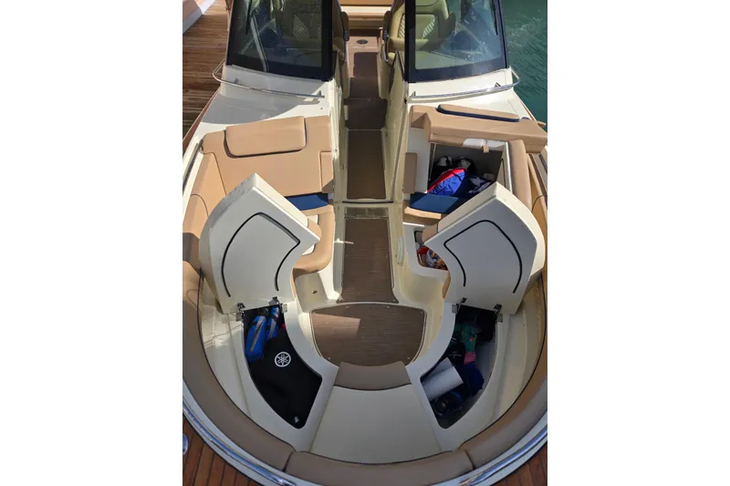 Slide: The Image of 2023 Chris-Craft Calypso 35 boat interior with open storage compartments and seating. - 13