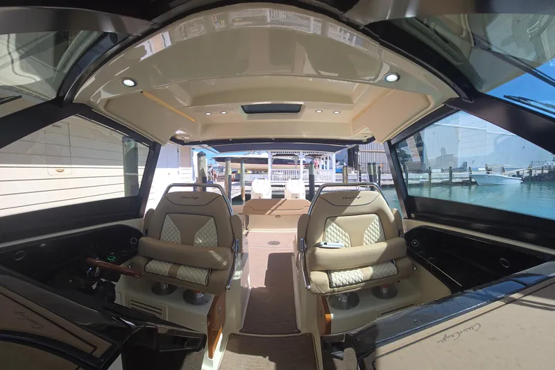 Slide: The Image of Interior view of 2023 Chris-Craft Calypso 35 boat, featuring luxurious seating and modern design. - 14