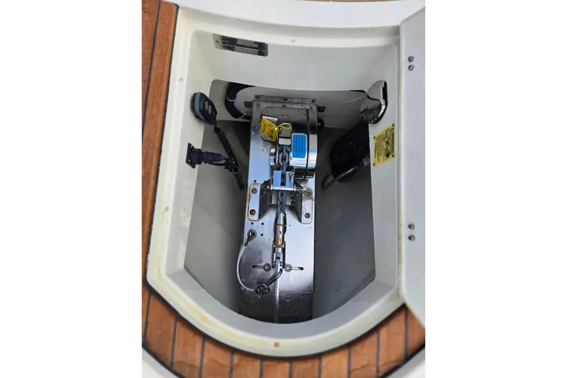 Slide: The Image of 2023 Chris-Craft Calypso 35 boat anchor compartment with mechanical components. - 31