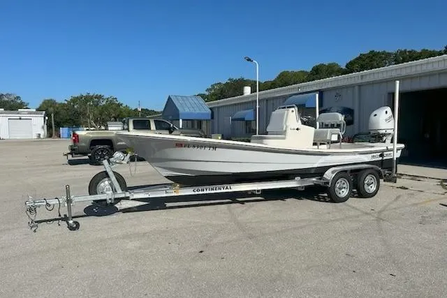 Slide: The Image of 2023 Abaco Skiff 20 boat on trailer in parking lot, clear sky background. - 3