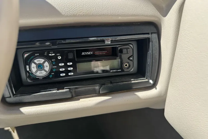 Slide: The Image of Jensen stereo system in a 2001 Reinell 203 boat dashboard. - 19