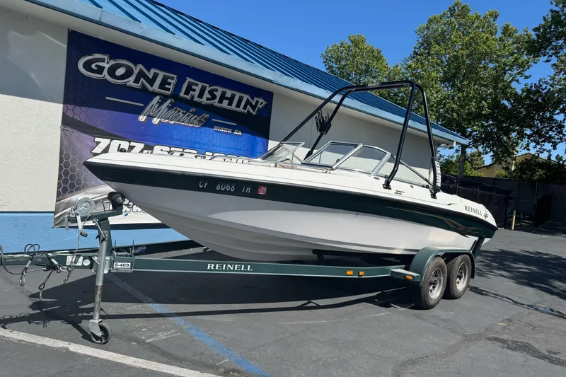 Slide: The Image of 2001 Reinell 203 boat on trailer at Gone Fishin' Marine dealership. - 3