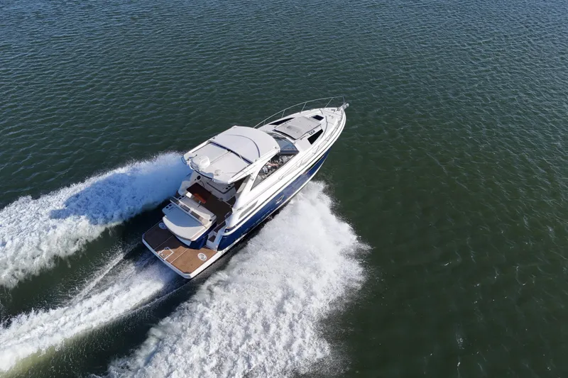 Slide: The Image of Aerial view of 2016 Regal 35 Sport Coupe cruising on open water. - 14